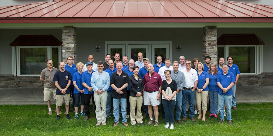 HVI Employees standing in front of their main office building